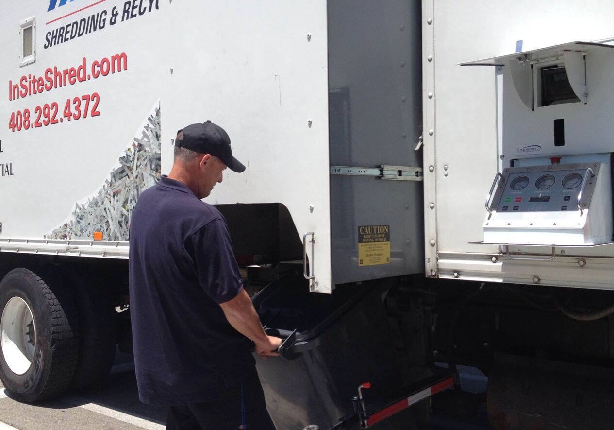 on site shredding service - loading paper bins onto truck on site shredding service - loading paper bins onto truck